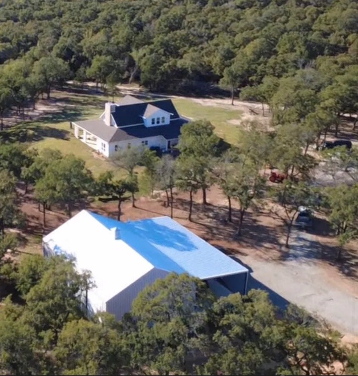 Aerial view of the farmhouse and shop